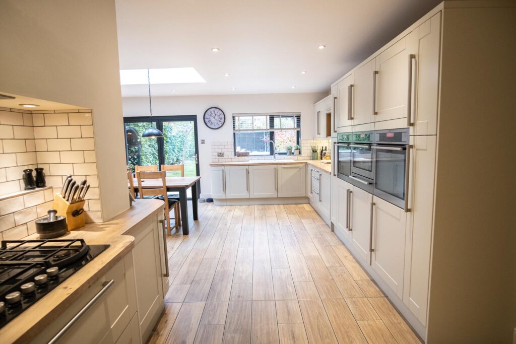 Kitchen storage with wooden worktops and integrated appliances